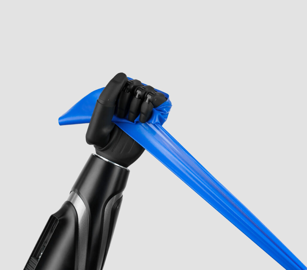 Bionic prosthetic hand gripping a resistance band