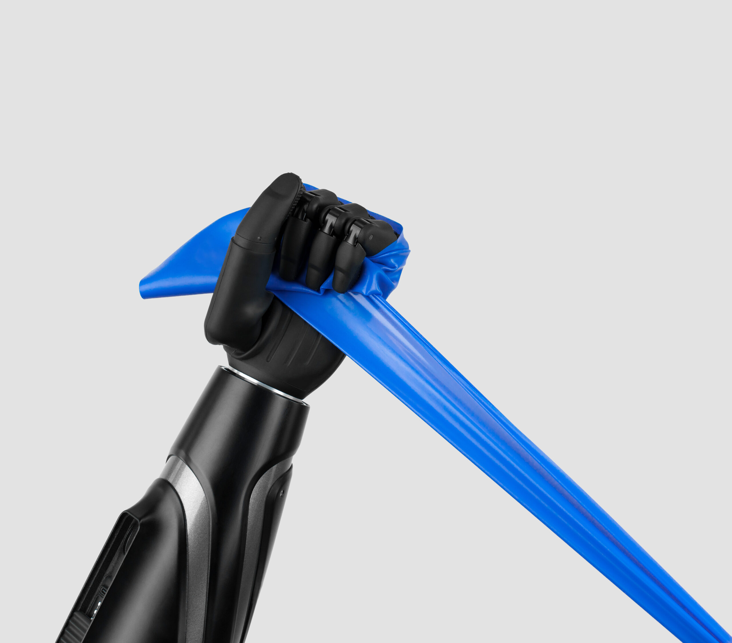 Bionic prosthetic hand gripping a resistance band